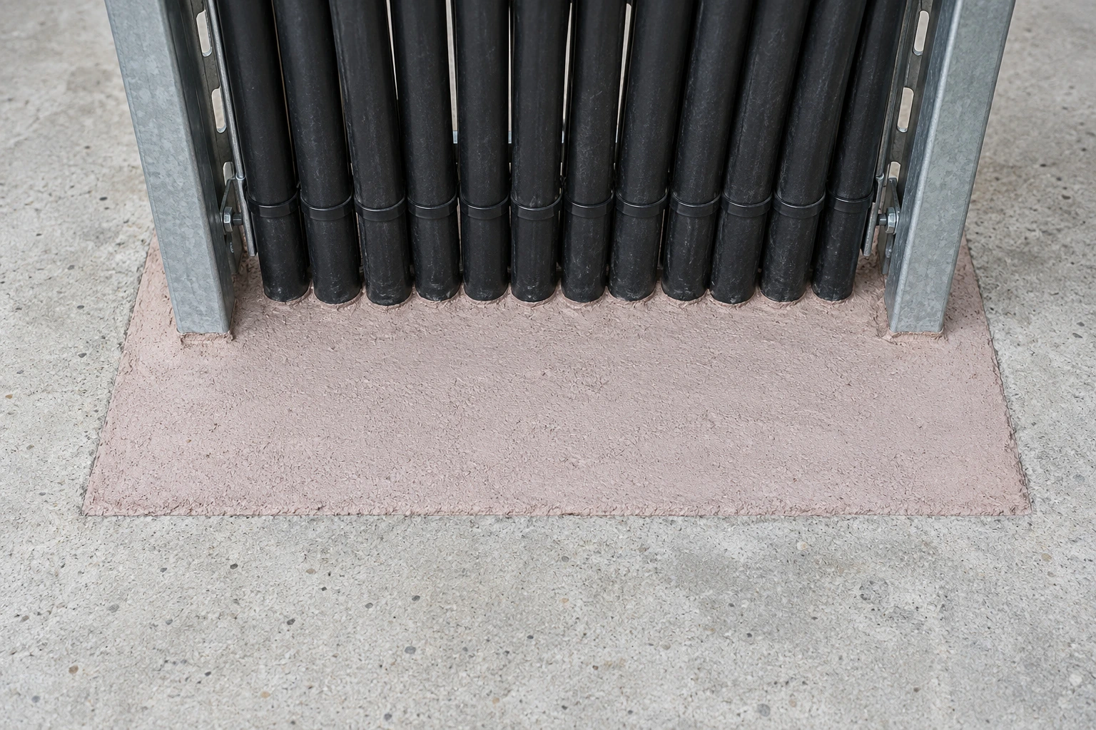 Firestop mortar tightly sealing a cable-tray penetration through a concrete floor