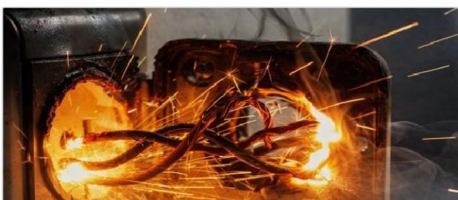 A live electrical fault igniting inside a panel
