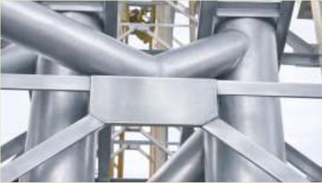Hot manifold pipework insulated in a thin ceramic film.