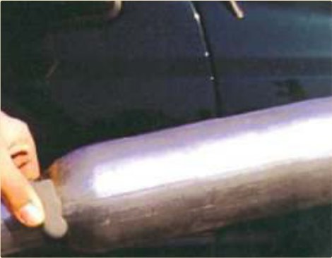 A wet pipe surface mended without draining the line.