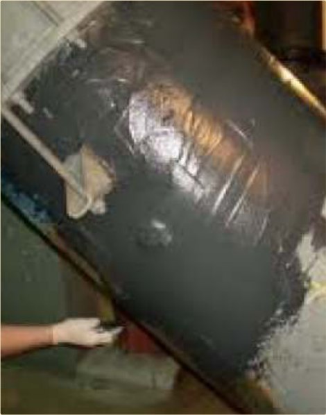 A corroded pipe section rebuilt and troweled smooth — no replacement.