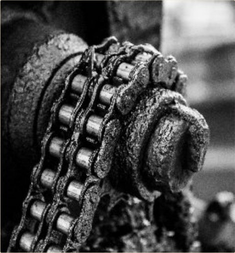 Caked chain-drive deposits stripped in place.