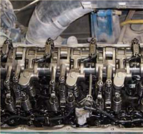 Valve gear assembled dry — no oil film to hold dust.