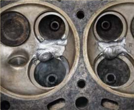 A cast-iron cylinder head welded cold — no oven, no distortion.