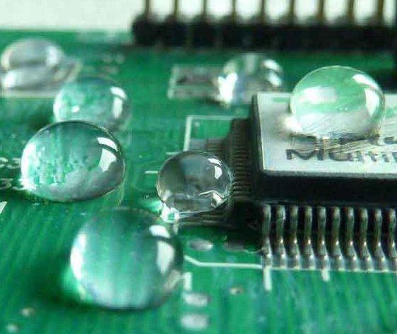 Water beading off a coated circuit board.