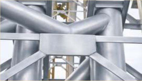 Hot manifold pipework insulated in a thin ceramic film.