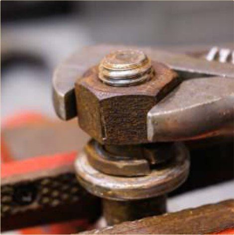 A seized nut released — not cut off.