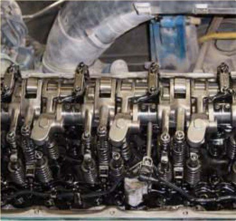 Valve gear assembled dry — no oil film to hold dust.