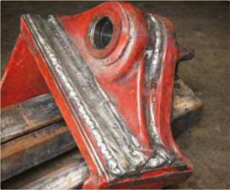 A heavy MS casting repaired — defect-free, on rusty, dirty steel.