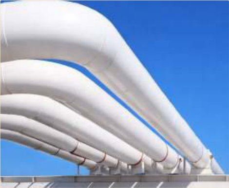 External pipe lines held gloss-white through coastal, humid service.