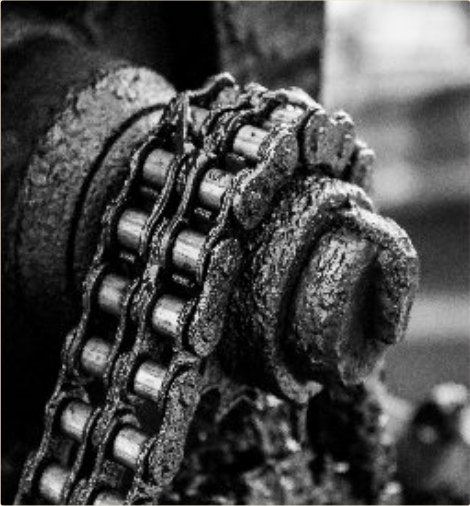 Caked chain-drive deposits stripped in place.
