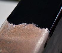 Rusted steel before, and blue-black converted steel after Z 704 treatment